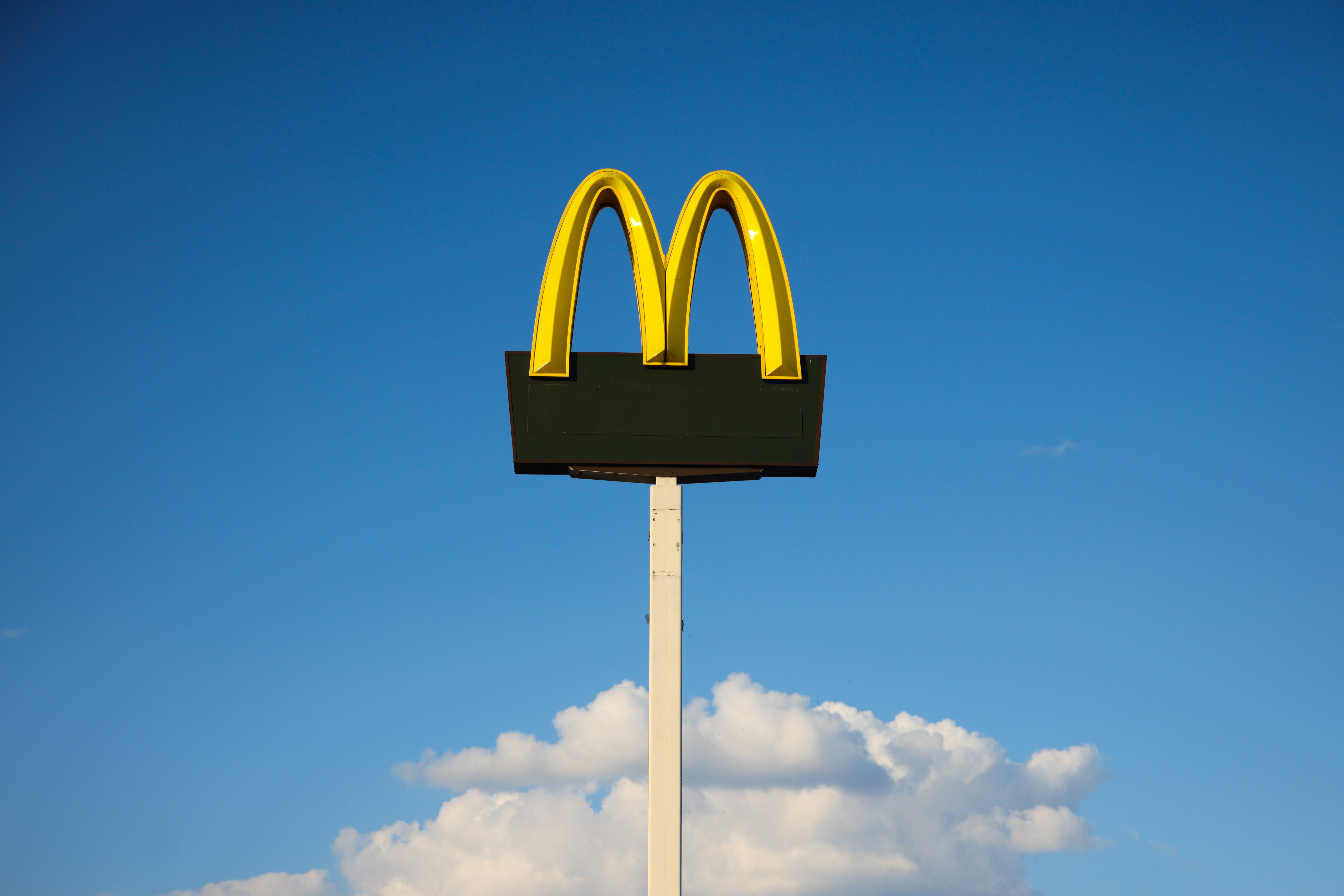 Mcdonald's logo against blue sky