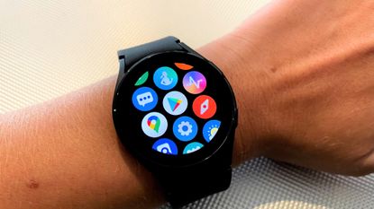 Samsung Galaxy Watch 4 smartwatch on a adult male's wrist