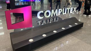 Computex logo in busy show floor in Taipei