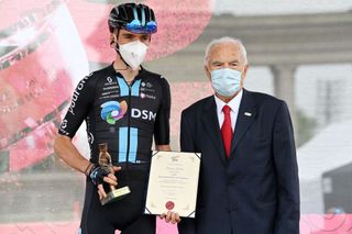 VISEGRAD HUNGARY MAY 06 Romain Bardet of France and Team DSM receives a Fair Play Trophy during the team presentation prior to the 105th Giro dItalia 2022 Stage 1 a 195km stage from Budapest to Visegrd 337m Giro WorldTour on May 06 2022 in Visegrad Hungary Photo by Stuart FranklinGetty Images