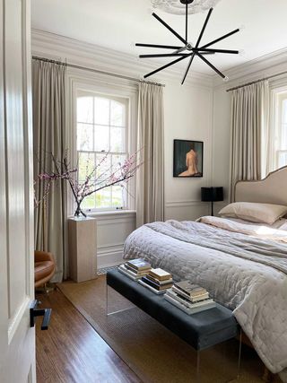 small bedroom with paneling by Kelly Hopter Interiors