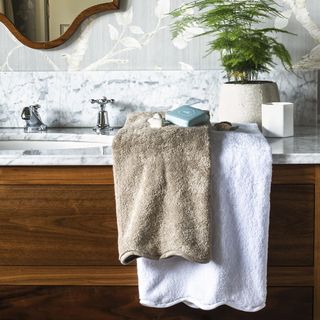 bathroom with towel on brown cabinet