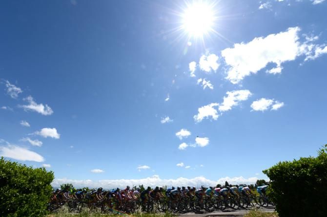 Blue skies and sun for the peloton on stage 13
