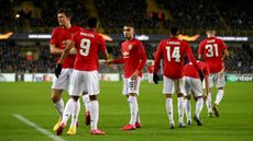 Manchester United players congratulate Anthony Martial on his goal against Club Bruges