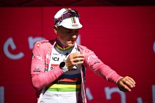 Belgian Remco Evenepoel of Soudal QuickStep celebrates on the podium after winning the first stage of the 2023 Giro DItalia cycling race an individual time trial from Fossacesia Marina to Ortona 196 km in Italy Saturday 06 May 2023 The 2023 Giro takes place from 06 to 28 May 2023BELGA PHOTO JASPER JACOBS Photo by JASPER JACOBS BELGA MAG Belga via AFP Photo by JASPER JACOBSBELGA MAGAFP via Getty Images
