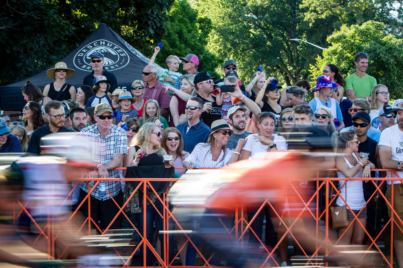 Fans watch as the Cascade Cycling Classic goes by.
