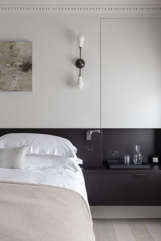 TR Studios black and white minimalist bedroom with built in storage