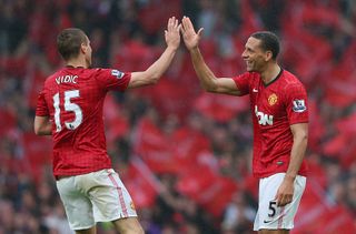 Rio Ferdinand of Manchester United celebrates scoring the winning goal with team-mate Nemanja Vidic during the Barclays Premier League match between Manchester United and Swansea City at Old Trafford on May 12, 2013 in Manchester, England. (Photo by Alex Livesey/Getty Images)
