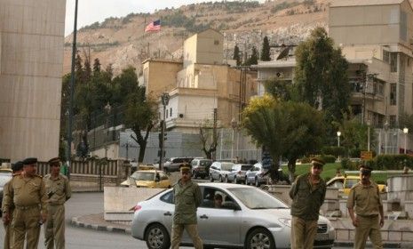 Syrian police stand in front of the U.S. embassy in Damascus in 2008: The Obama administration closed the embassy on Monday and ordered all of its diplomats to leave the country.