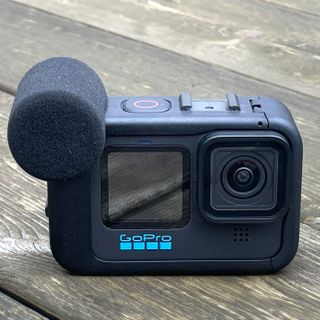 GoPro Media Mod on a GoPro Hero camera on a wooden surface