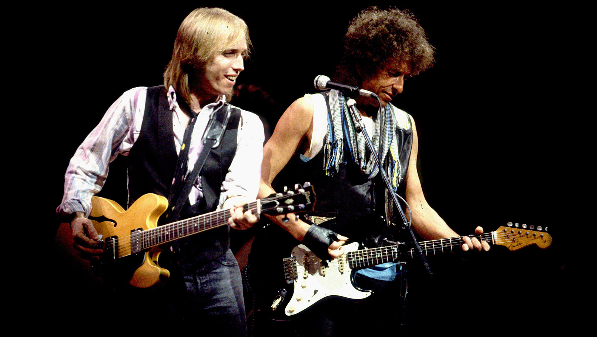Tom Petty and Bob Dylan during Bob Dylan and Tom Petty in Concert - July 22, 1986 at Poplar Creek Music Theater in Chicago, Illinois, United States.