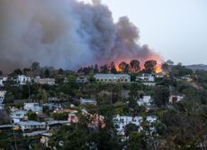 Smoke from the Palisades Fire fills the sky as seen from the Pacific Palisades neighborhood of Los Angeles, California on January 07, 2025 in Los Angeles, California. 