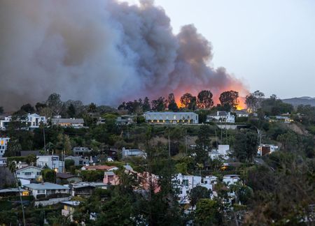 Smoke from the Palisades Fire fills the sky as seen from the Pacific Palisades neighborhood of Los Angeles, California on January 07, 2025 in Los Angeles, California. 