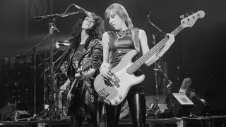 Kim McAuliffe (left) and Gil Weston (right) from Girlschool perform live on stage at the Rainbow Theatre in Finsbury Park, London in March 1982
