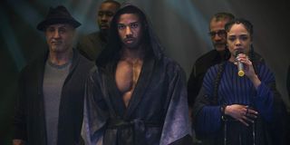 Creed II Rocky, Adonis, and Bianca walk into the ring
