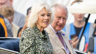 King Charles and Queen Camilla travel in a carriage as they visit Sandringham Flower Show at Sandringham House on July 26, 2023