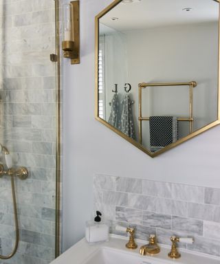 A small bathroom with brushed brass details