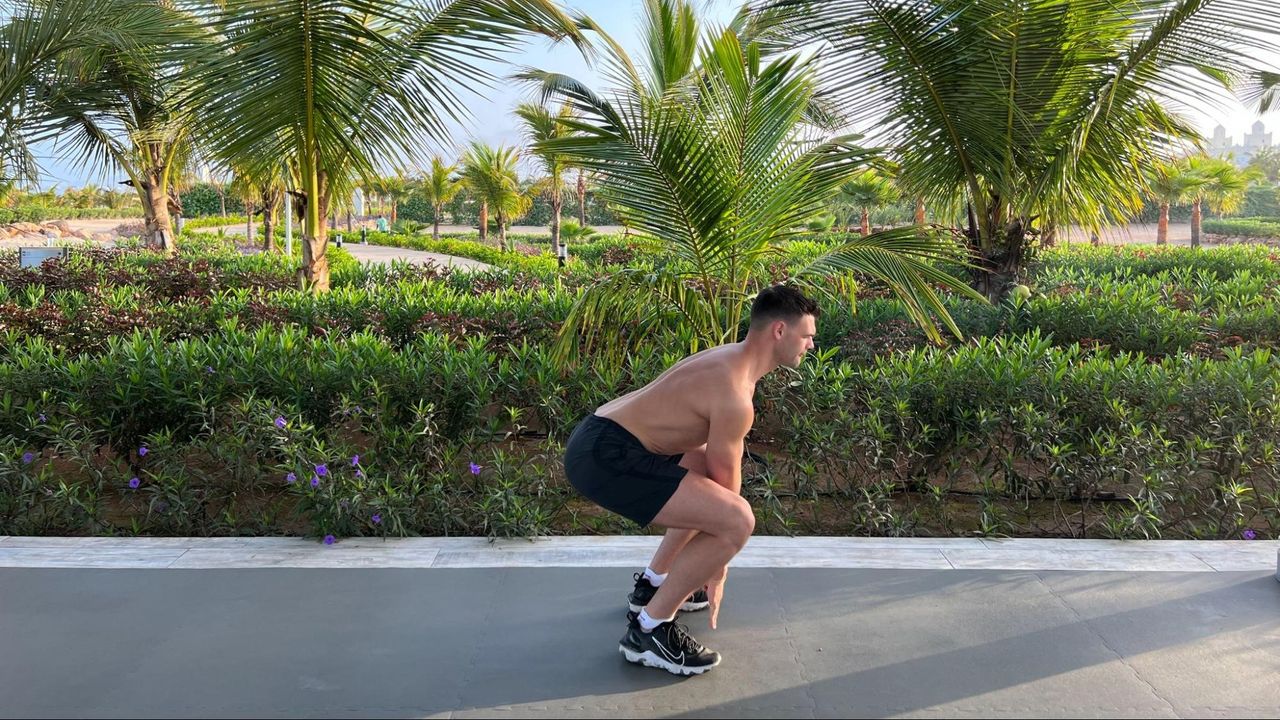 Sam Shaw in a low squat position