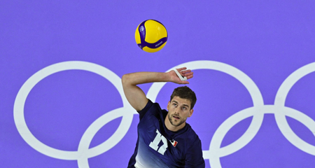 France's #17 Trevor Clevenot spiking the ball ahead of the