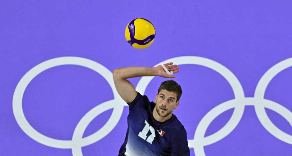 France&#039;s #17 Trevor Clevenot spiking the ball ahead of the France vs Poland men’s volleyball final at Olympics 2024