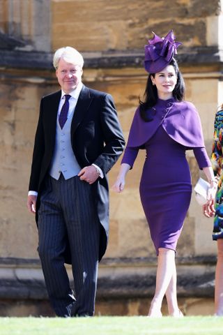 Charles Spencer and Karen Spencer wearing a suit and purple dress attending Prince Harry and Meghan Markle's wedding