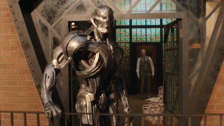 Ultron standing on a balcony with Vision in the background in VisionQuest