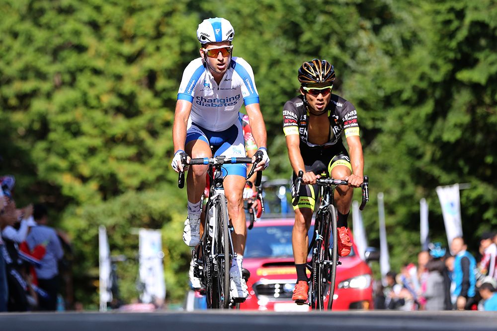 Riders crest the climb