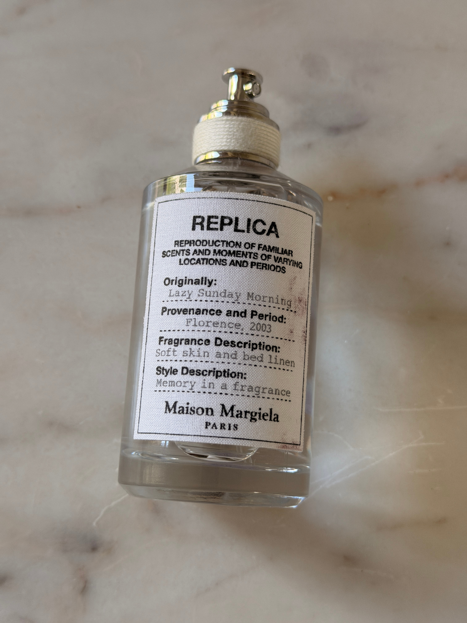 A bottle of Maison Margiela Replica Lazy Sunday Morning perfume