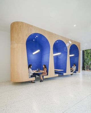 blue working booths at bank in Peru by WorkAC
