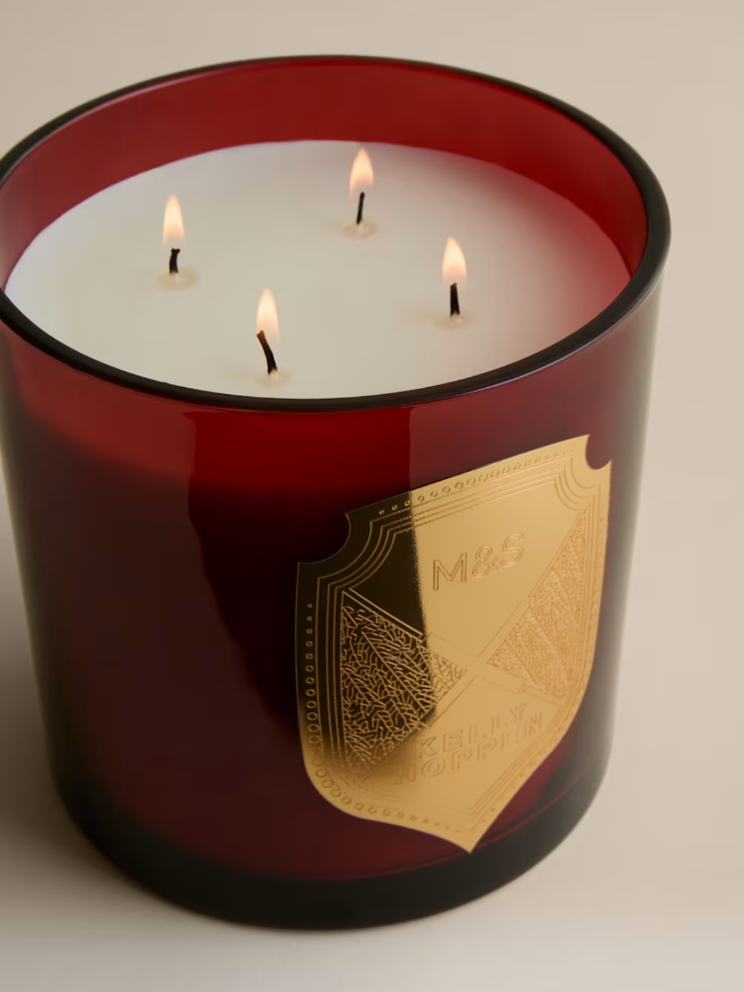 A red glass scented Christmas candle from M&amp;amp;S X Kelly Hoppen