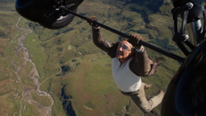 Tom Cruise hanging from a plane in Mission Impossible: The Final Reckoning.