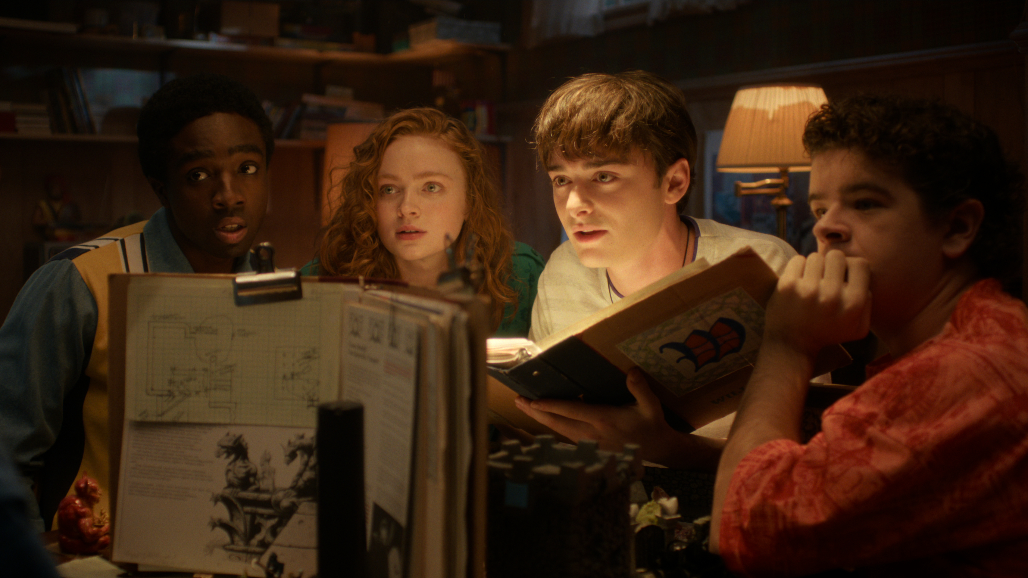 L-R: Lucas (Caleb McLaughlin), Max (Sadie Sink), Will (Noah Schnapp), Dustin (Gaten Matarazzo) playing Dungeons and Dragons in the "Stranger Things" season 5 finale