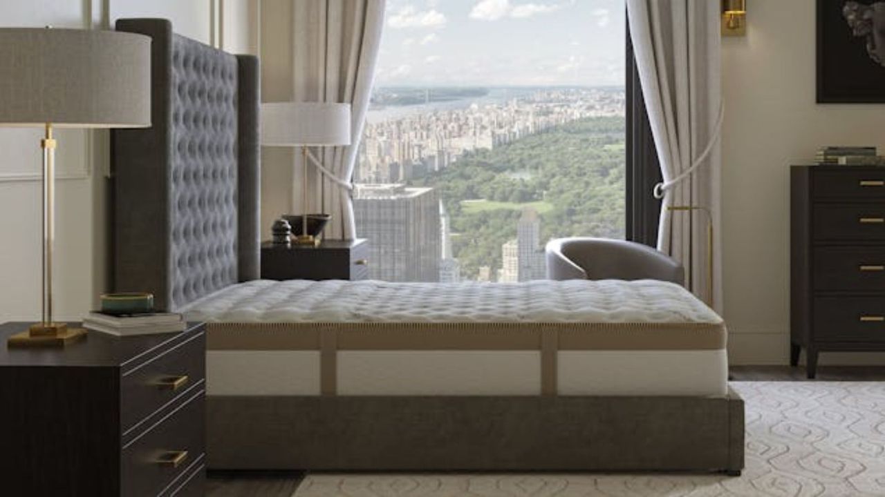 Saatva Loom &amp; Leaf on a bed against a window looking out onto Central Park.