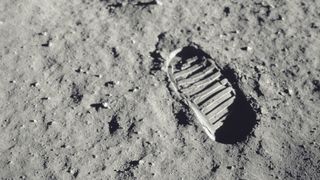 An astronauts footprint on the lunar surface.