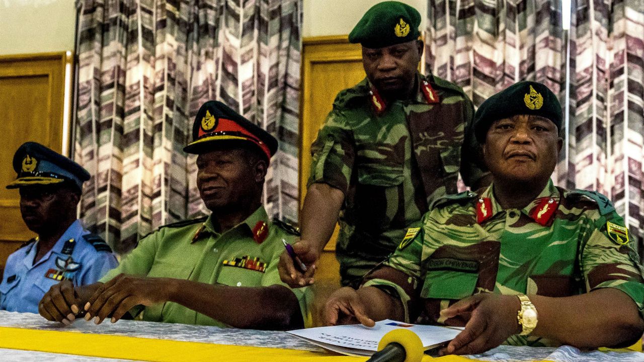 Zimbabwe&amp;#039;s army, led by Gen Constantino Chiwenga (right) has vowed to &amp;#039;step in&amp;#039; to stop purges within Zanu-PF