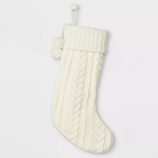 A cream cable knit stocking