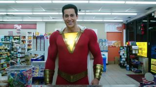 Costumed Zachary Levi smirking in convenience store in Shazam!