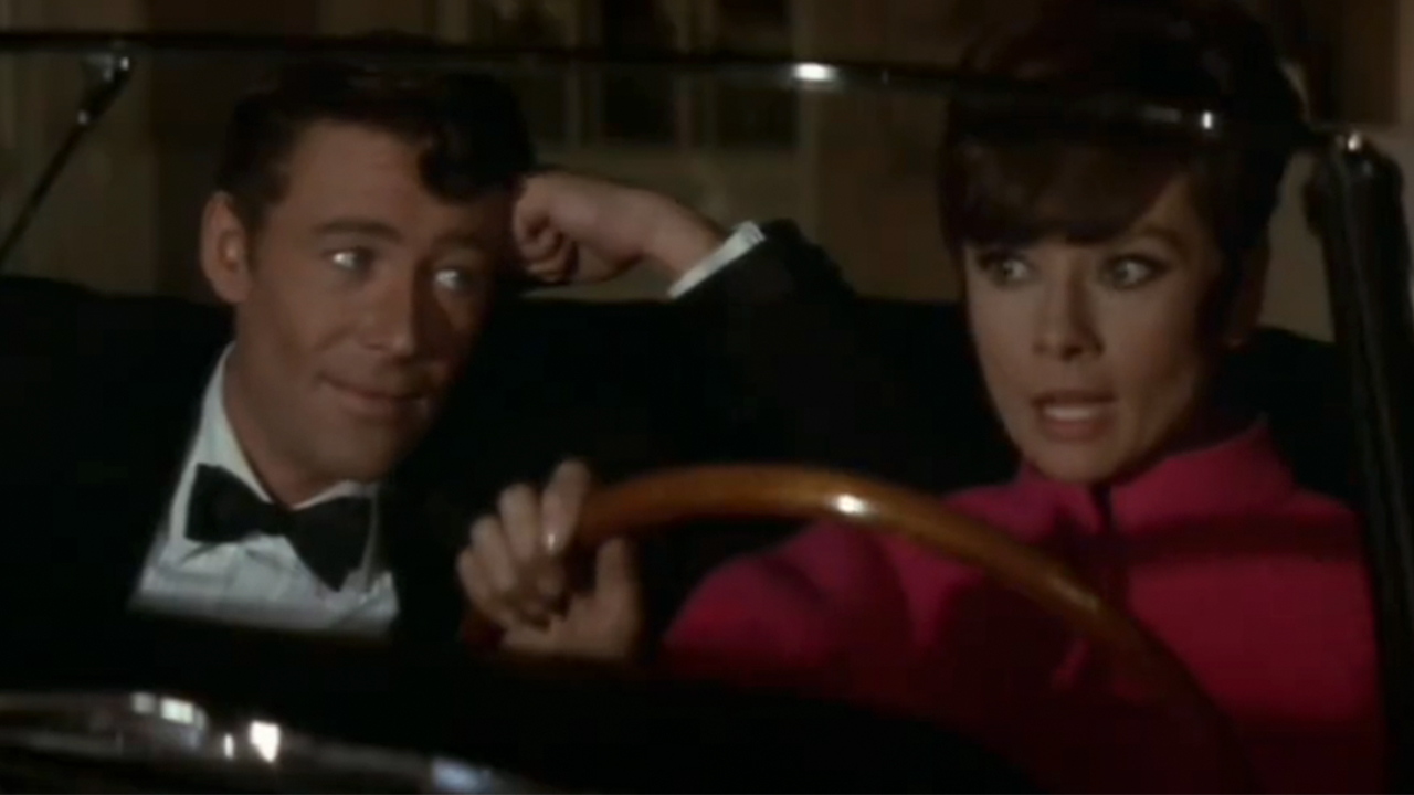 Peter O&#039;Toole and Audrey Hepburn in a car in How To Steal A Million