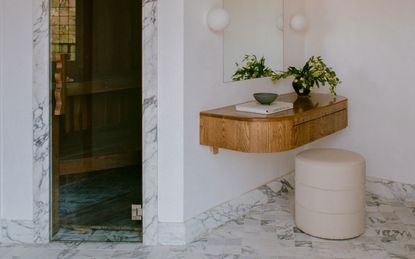 A minimaluxe bathroom design with marble trim
