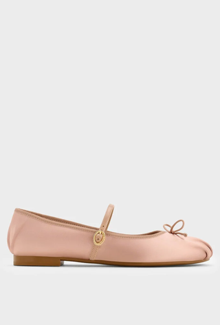 A picture of pale pink satin ballet flats. 