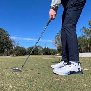 Dan Parker at address to a golf ball wearing a pair of the FootJoy Fuel 2025 golf shoes