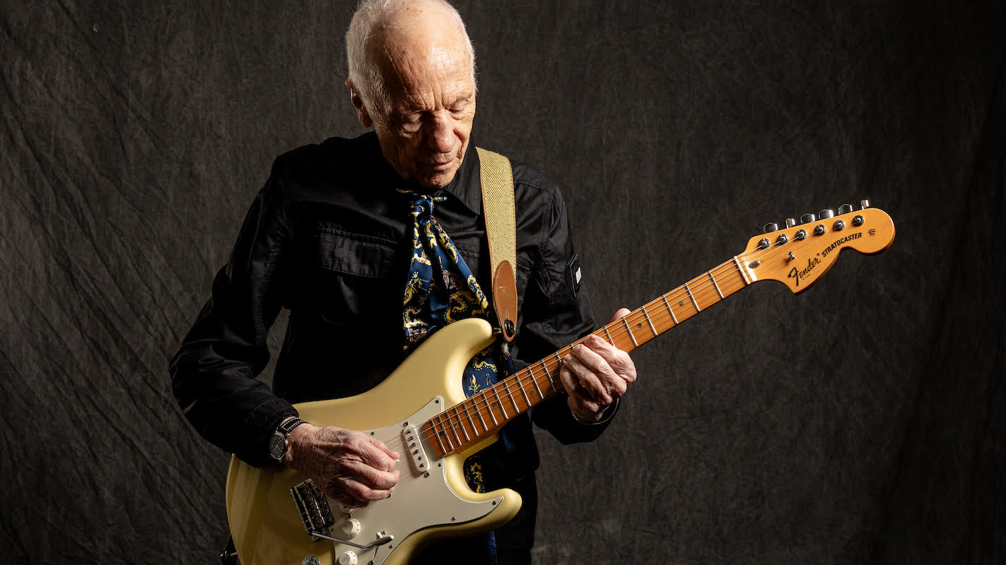 Robin Trower poses with his signature Fender Stratocaster