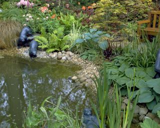 garden pond with several animal pond ornaments