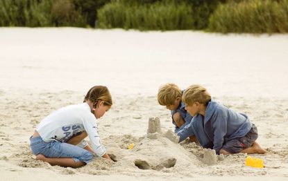 children building sandcastles