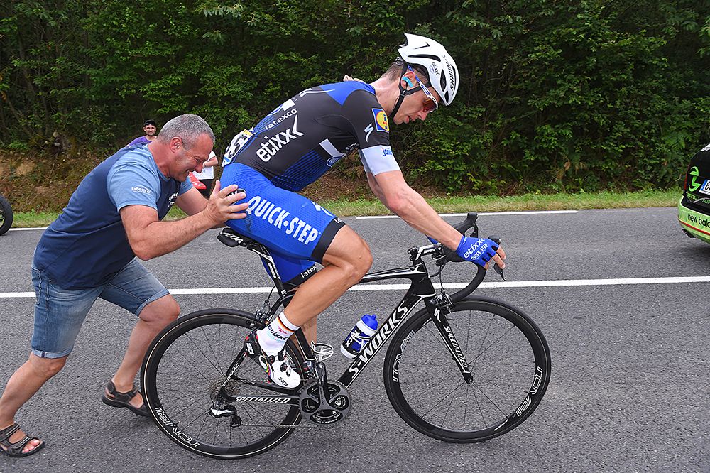 Tony Martin (Etixx) gets a push after a mechanical
