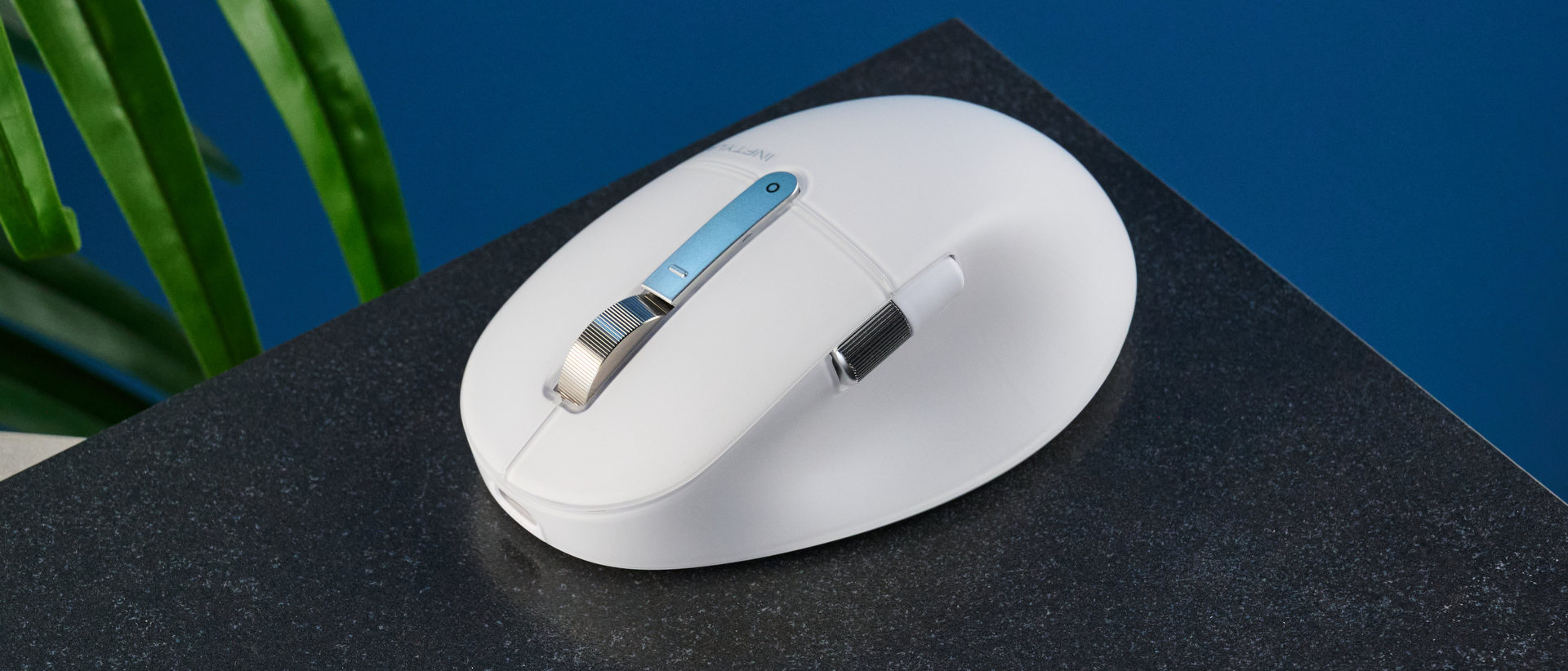 A white BenQ INFTYLAB M Mouse PS01 mouse