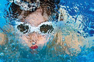 Swimmer: From a series of photographs taken of my son under the water in our neighbourhood pool. Capturing the joy of swimming as my son submerges. The combination of colour, distortion, and his eventual disappearance into the depths serves as a portal and signals the beginning of his journey into the wonderland found below the surface of the water. The primary focus of my artwork is to capture not only my son’s love of swimming, but also the distorted combination of colour, light and texture.