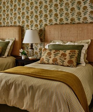yellow floral wallpapered spring bedroom with seasonal nightstand
