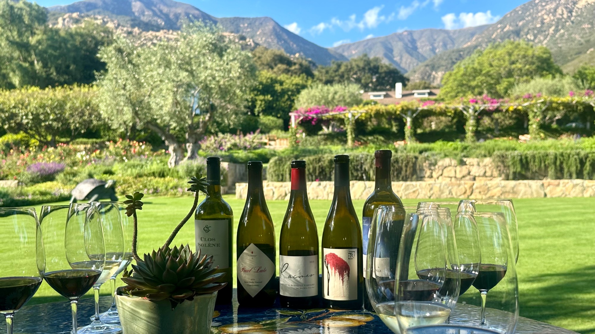 Wine glasses and bottles on a table at San Ysidro Ranch