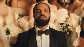 Drake in "Falling Back" Music Video surrounded by women dressed in wedding gowns. 